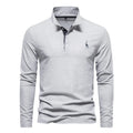 A modern light gray long-sleeve polo shirt with an embroidered logo, offering a clean and minimalist aesthetic.