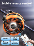 Fan shown hanging from tent ceiling with lights on