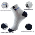 A close-up of gray socks with a reinforced heel, seamless toe, and soft cotton blend for enhanced durability.