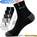 A stack of black, gray, and white men's crew socks with a bamboo fiber blend for comfort and breathability