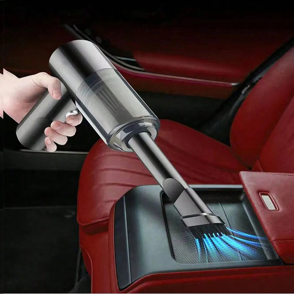 A sleek, handheld car vacuum being used to clean a car seat, with a bright LED light illuminating dust and debris.
