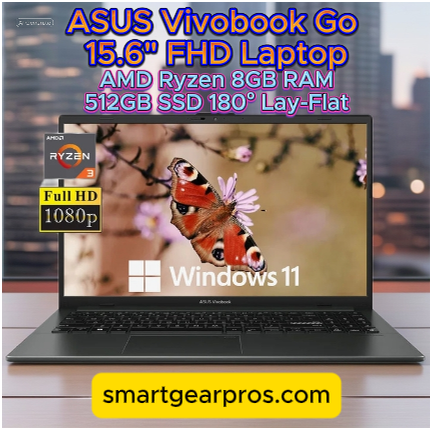 ASUS Vivobook Go laptop displayed on a wooden desk with a blurred city skyline behind it. The screen shows a vivid butterfly on a flower, highlighting specs like Full HD 1080p, AMD Ryzen 3, 8GB RAM, and 512GB SSD. A yellow banner at the bottom reads "smartgearpros.com".