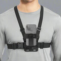 The chest strap phone holder with adjustable mount harness being worn on a man.